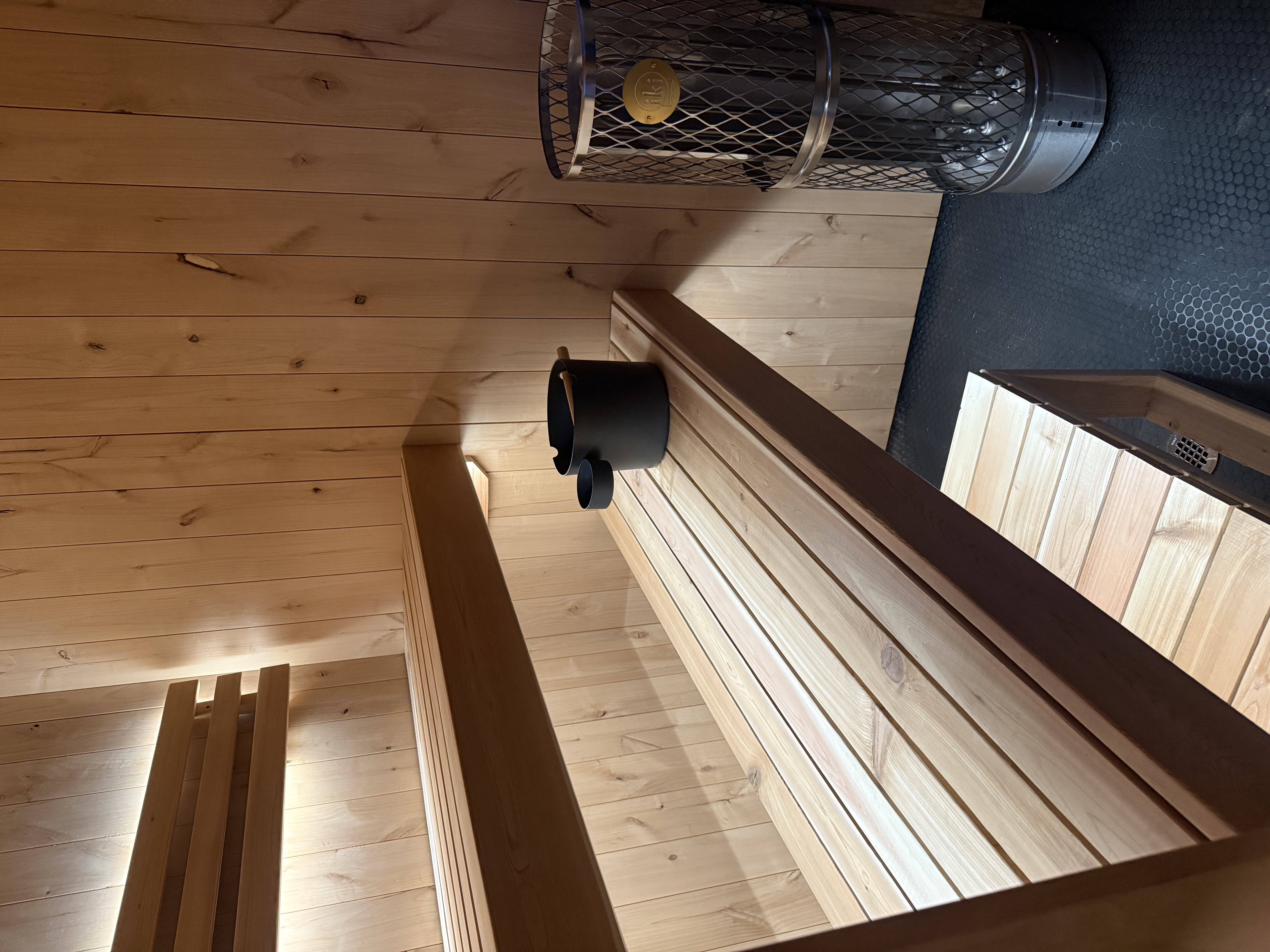 Alderwood custom sauna — Custom alder sauna cedar benches with IKI pillar heater.JPG